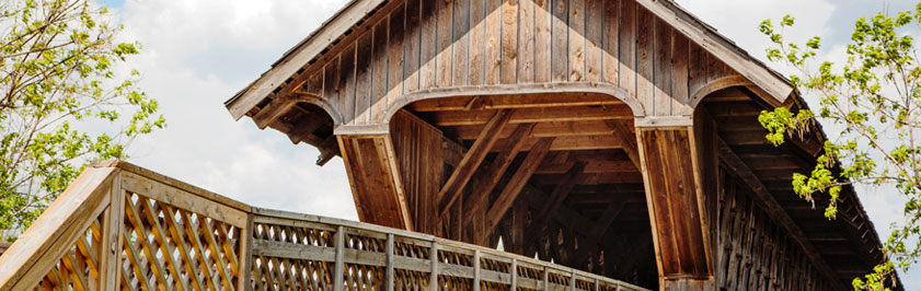 Covered bridge made of wood on a sunny day