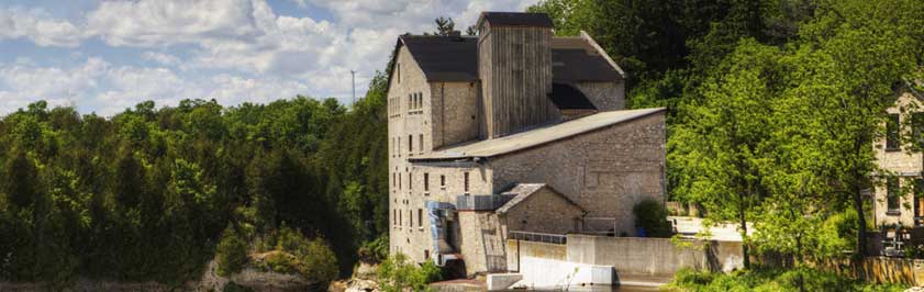 stone building beside a river