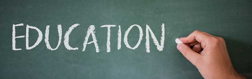 Education written on a green chalk board